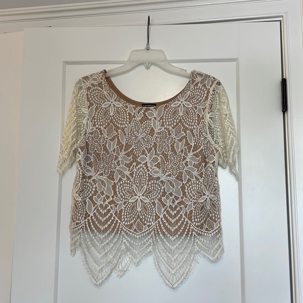 White lace top from Express with beige slip underneath attached